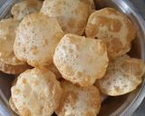 A picture of step 11 of Luchi and Cholar Dal.