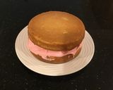 A picture of step 22 of Almond Layer Cake with Rasberry Cream Filling.