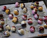 A picture of step 2 of White Chocolate dipped Cherries.