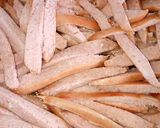 A picture of step 2 of Shallow fried sausage strips.
