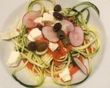 A picture of step 4 of Zucchini Spaghetti with Tomato Sauce, Kalamata Olives, Feta, and Radishes.
