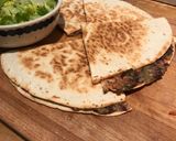 A picture of step 4 of Cheesy Black Bean Quesadillas.