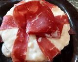 Foto del passaggio 14 della ricetta Risotto al Melone Fonduta di Brie Bresaola Pistacchi e Menta Fresca