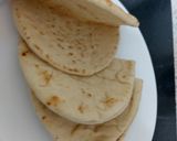 A picture of step 6 of My Salt n Chilli Peppered Chicken on a folded flatbread. 😋.