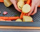 A picture of step 11 of Roast Chicken with Potatoes & Carrots.
