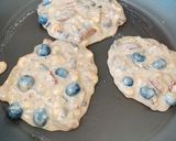 A picture of step 3 of Banana pancakes with pecan nuts and fresh blueberries.