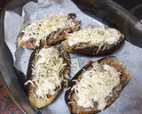 Foto del paso 7 de la receta: Berenjenas rellenas de carne picada y setas al ajillo