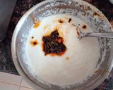 A picture of step 2 of , Chutney and tomato ketchup filled idli.