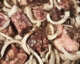 A picture of step 7 of Goat and Onions.
