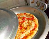 A picture of step 18 of Chicken tikka pizza in lock down (karahi baking).