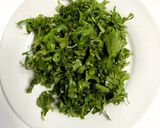 A picture of step 1 of Thankuni Pata Diye Musurir Dal (Centella Leaves Cooked with Red Lentils - Bong Style).