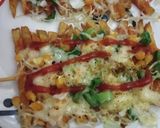 A picture of step 3 of French fries pizza.