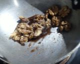 A picture of step 7 of Walnut phirni in chocolate square.