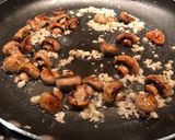A picture of step 4 of Crispy chicken thigh with angel hair, mushroom and garlic butter cilantro sauce.