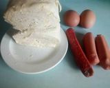 A picture of step 1 of Egg wrapped in sausage and puff.