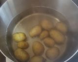 A picture of step 3 of Cheesy new potato squares.