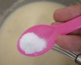 A picture of step 3 of Eggless mawa cup cake topping with shrikhand.