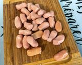 A picture of step 5 of Mini Pork Sausages with Red Pesto, Garlic, Onion, and Oregano.