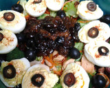 A picture of step 12 of Buttery broccoli salad topped with deviled eggs.
