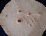 A picture of step 4 of Tortilla Wrap with egg and veggies.