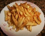 Foto del paso 6 de la receta Filetes de pollo especiados, con patatas fritas y huevo con yema frita