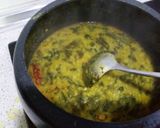 A picture of step 9 of Moogdal with spinach.