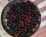 A picture of step 1 of Mulberry Orange Sunset layered Mocktail.