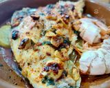 Foto del paso 6 de la receta Dorada al horno con gambones, patata y cebolla