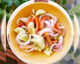 A picture of step 1 of Cucumber and Tomato Salad.