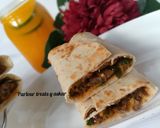 A picture of step 13 of Saucy beef wraps.