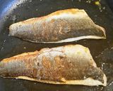 A picture of step 9 of Pan fried seabass fillets on a bed of citrus broccoli.