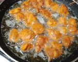 A picture of step 2 of Chicken 65 with gravy.