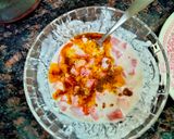 A picture of step 3 of Tomato Raita seasoned with Mustard seeds.