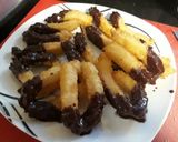 A picture of step 7 of Churros with Chocolate Sauce.