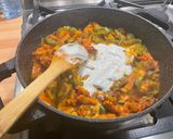 A picture of step 17 of Chicken and Bacon with Peppers, Tomatoes, Spices, and Coconut Milk.