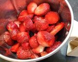 A picture of step 2 of Strawberry milk shake with dollop of strawberry ice cream.