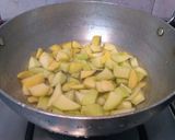 A picture of step 3 of Amlechi Uddamethi Raw Mango curry.