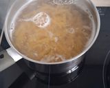 A picture of step 1 of Creamy Tomato Penne with Pork and Basil.