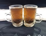 A picture of step 3 of Tulsi and Palm Jaggery Tea.