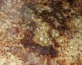 A picture of step 5 of Seafood indomie with fish chunks.