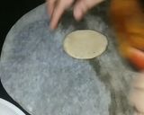 A picture of step 10 of Ashtami special prasaad the puri chana and halwa thali.