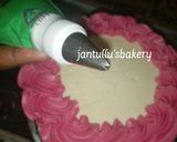 A picture of step 6 of Drips buttercream icing cake.