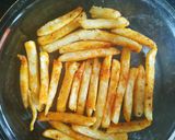 A picture of step 2 of French fries pizza.