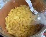 A picture of step 1 of Creamy Garlic Chicken Pasta with Tomato Spinach & Mushrooms.