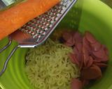 A picture of step 2 of Martabak Mie (Fried dumpling noodle and sausage).