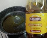 A picture of step 2 of Sweet and Spicy Raw Mango Curry with Jaggery.