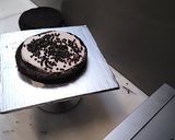 A picture of step 1 of 8 inch tall chocolate brownie cake.