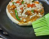 A picture of step 8 of Paneer Tikka Cheese Burst Pizza, without oven.