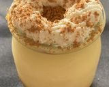 A picture of step 6 of Custard and Lotus Biscoff Cookie Cake.