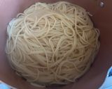 A picture of step 1 of Garlic Noodles with Shrimp.